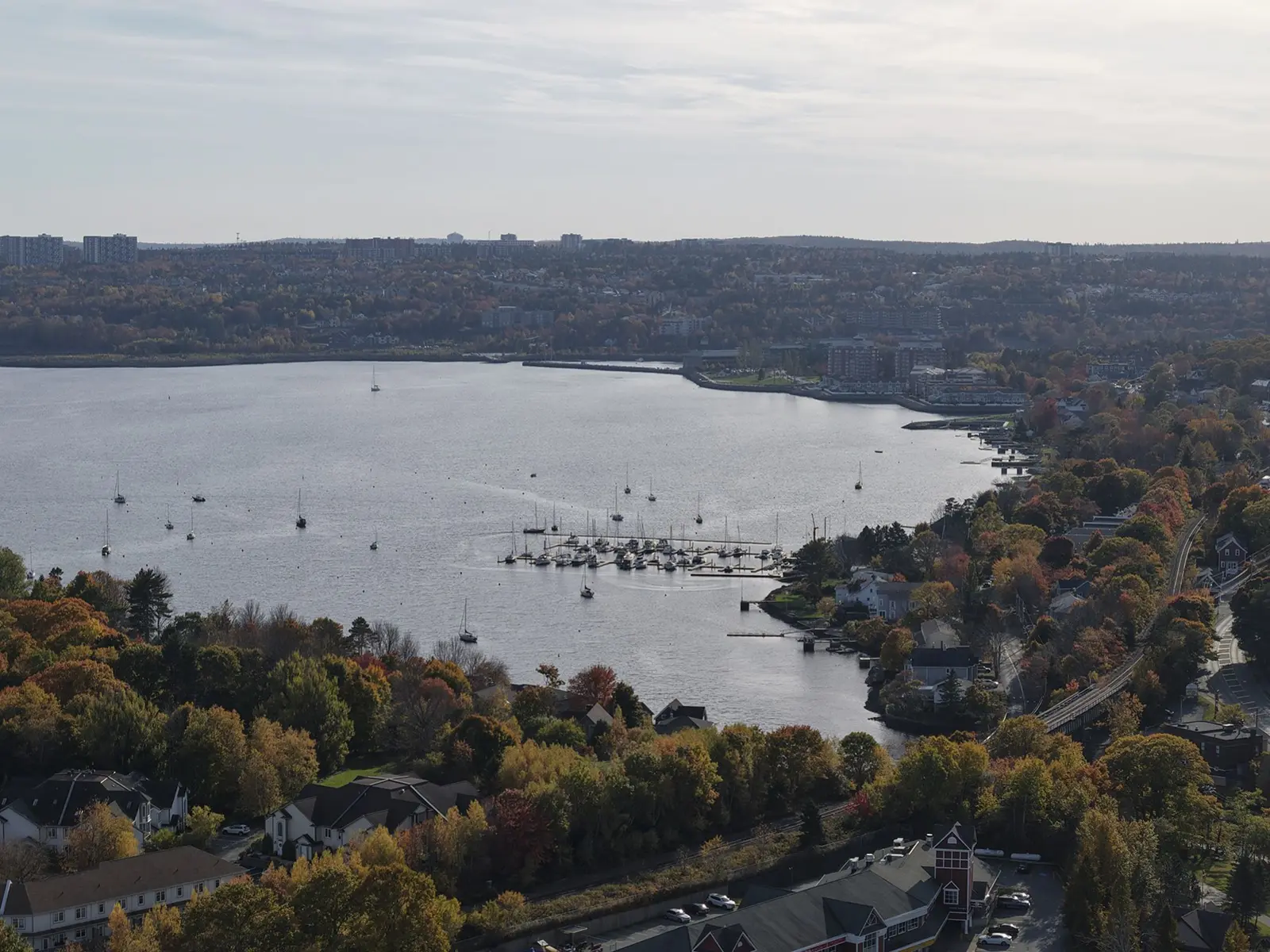 A waterfront club and marina seen along the shoreline